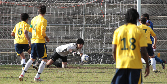 1 - Takumi Takahashi (GK) - stretching for the ball